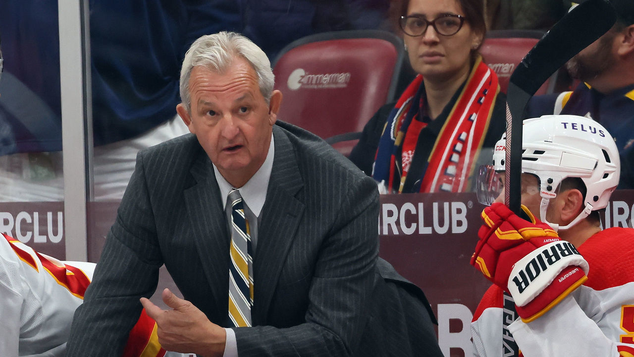 SUNRISE, FLORIDA - NOVEMBER 19: Head coach Darryl Sutter of the Calgary Flames handles the bench during the third period against the Florida Panthers at FLA Live Arena on November 19, 2022 in Sunrise, Florida. The Flames defeated the Panthers 5-4 in the shootout.