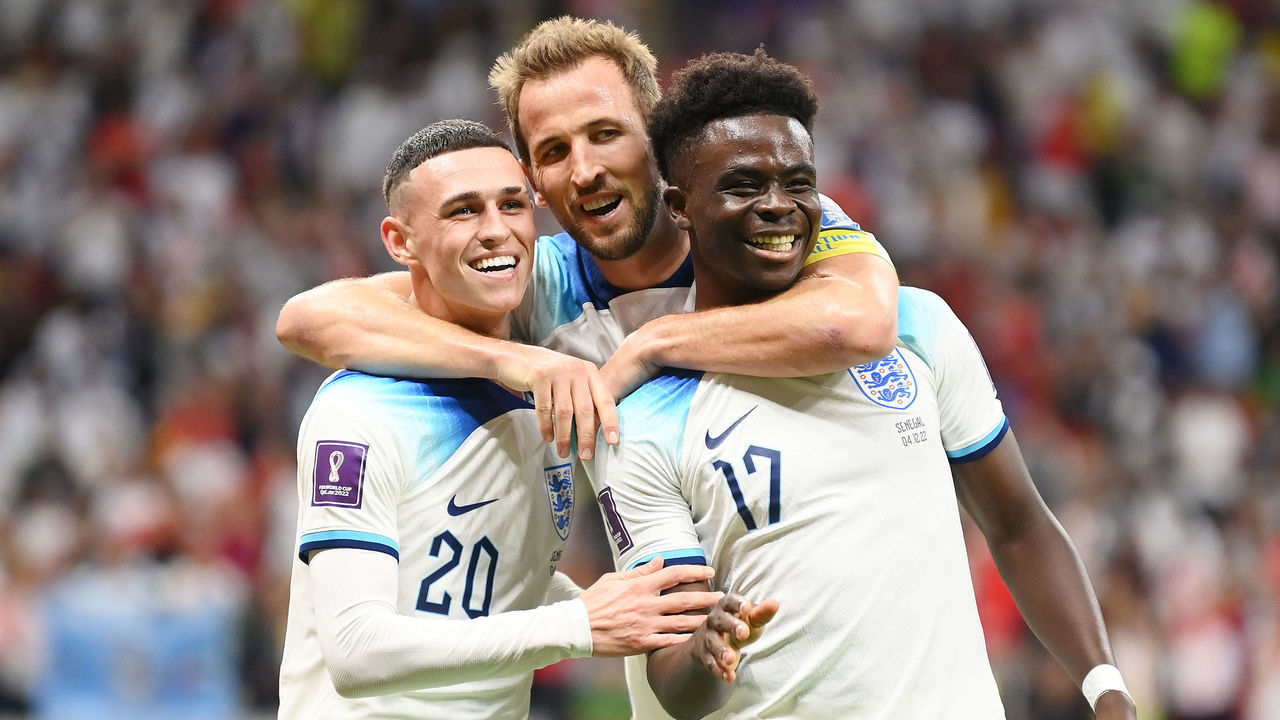 AL KHOR, QATAR - DECEMBER 04: Bukayo Saka of England celebrates with Phil Foden and Harry Kane after scoring the team's third goal during the FIFA World Cup Qatar 2022 Round of 16 match between England and Senegal at Al Bayt Stadium on December 04, 2022 in Al Khor, Qatar.