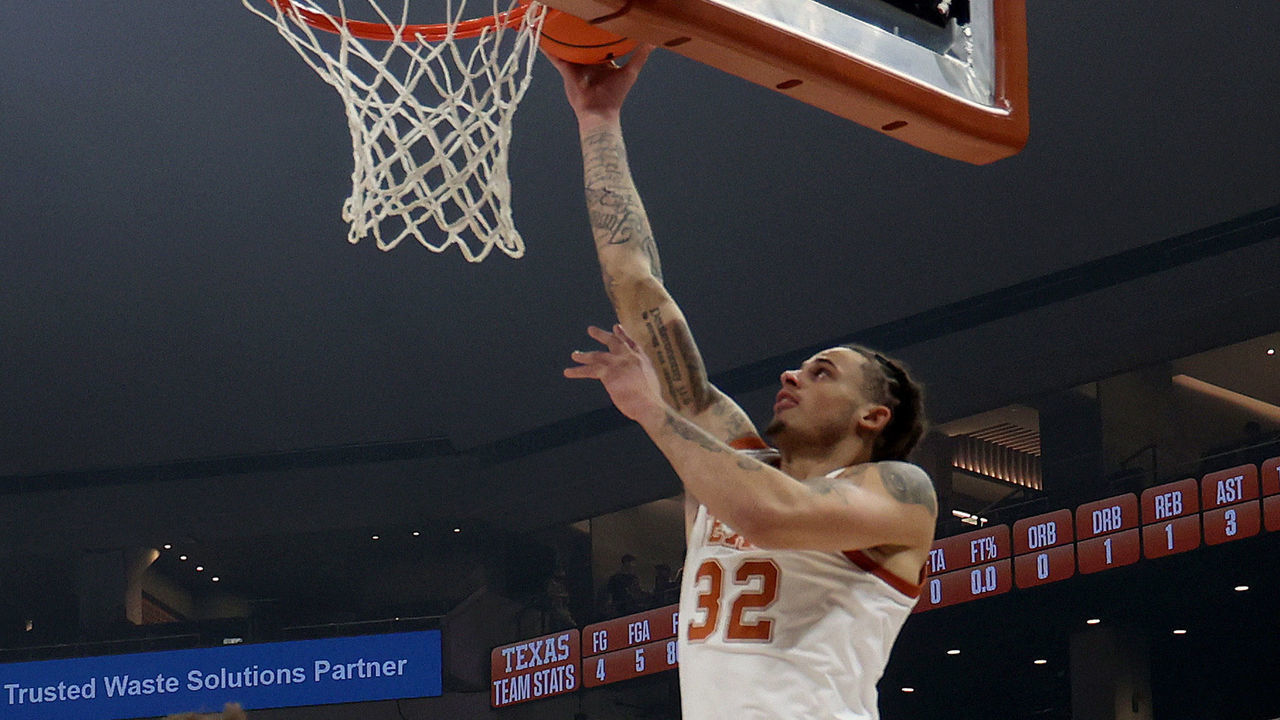 AUSTIN, TEXAS - DECEMBER 10: Christian Bishop #32 of the Texas Longhorns shoots over Brahm Harris #14 of the Arkansas-Pine Bluff Golden Lions during the game between Arkansas - Pine Bluff Golden Lions and the Texas Longhorns at Moody Center on December 10, 2022 in Austin, Texas.