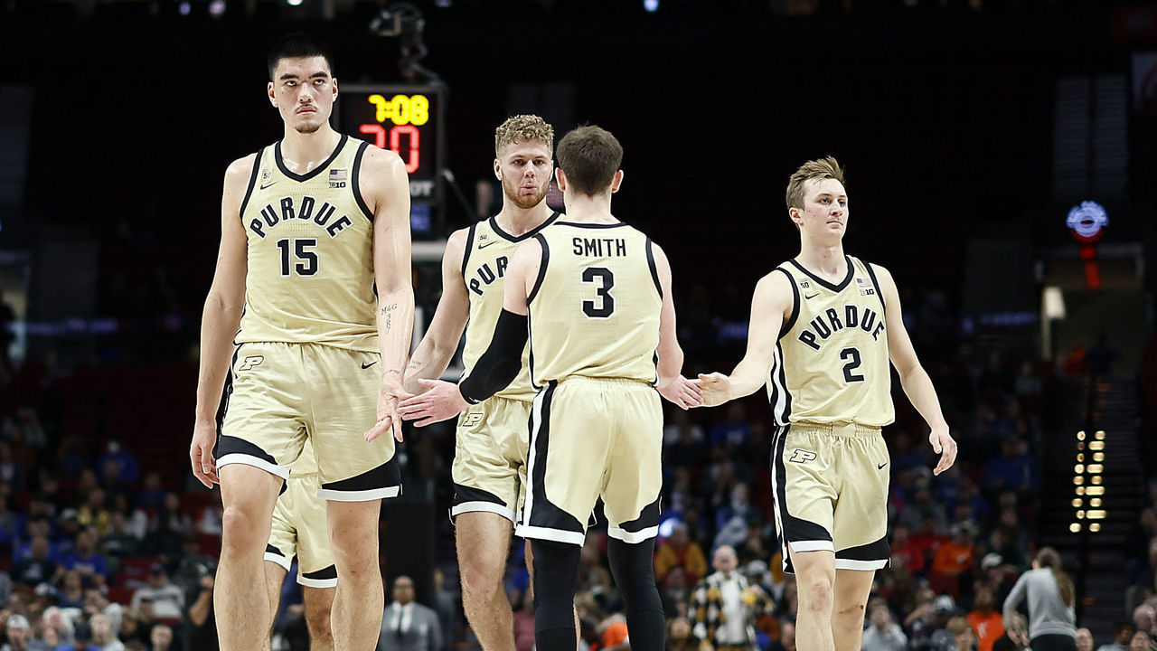 PORTLAND, OREGON - NOVEMBER 27: Zach Edey #15, Caleb Furst #1, Braden Smith #3, and Fletcher Loyer #2 of the Purdue Boilermakers walk back to the court after a timeout against the Duke Blue Devils during the second half of the Phil Knight Legacy Tournament Men’s Championship at Moda Center on November 27, 2022 in Portland, Oregon.