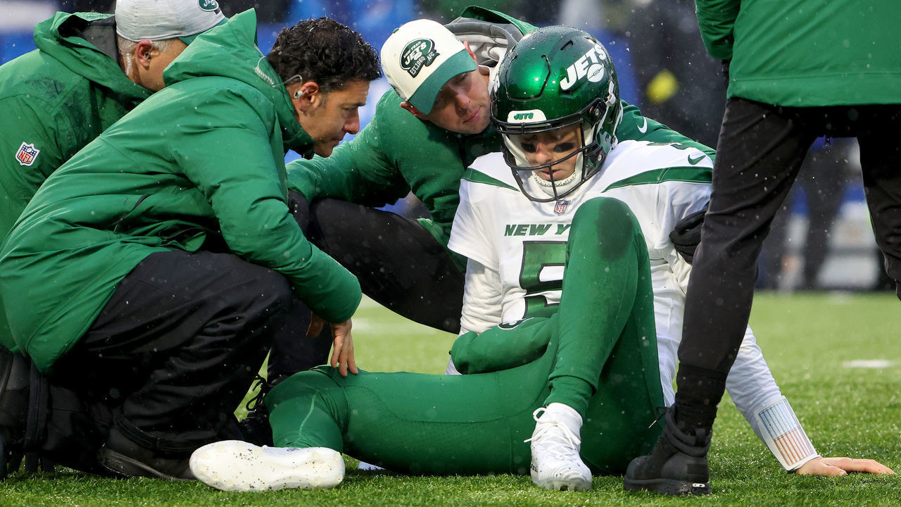 ORCHARD PARK, NEW YORK - DECEMBER 11: Mike White #5 of the New York Jets is looked at by the medical staff during the first half against the Buffalo Bills at Highmark Stadium on December 11, 2022 in Orchard Park, New York.