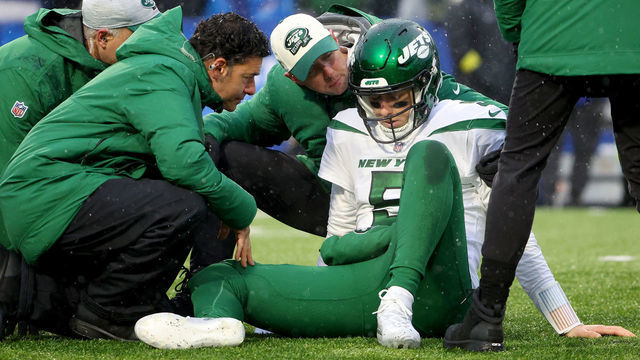 ORCHARD PARK, NEW YORK - DECEMBER 11: Mike White #5 of the New York Jets is looked at by the medical staff during the first half against the Buffalo Bills at Highmark Stadium on December 11, 2022 in Orchard Park, New York.