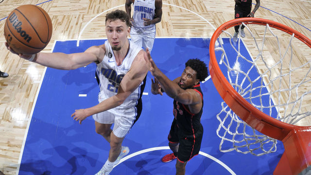 ORLANDO, FL - DECEMBER 9: Franz Wagner #22 of the Orlando Magic drives to the basket against the Toronto Raptors on December 9, 2022 at Amway Center in Orlando, Florida. Mandatory Copyright Notice: Copyright 2022 NBAE