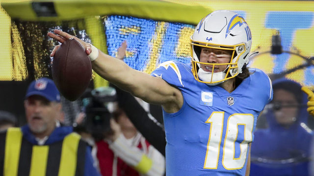 Los Angeles, CA - December 11: Los Angeles Chargers quarterback Justin Herbert reacts after getting a first diwb ib a quarterback scramble during the second half against the Miami Dolphins at SoFi Stadium on Sunday, Dec. 11, 2022 in Los Angeles, CA.(Allen J. Schaben / Los Angeles Times via Getty Images)