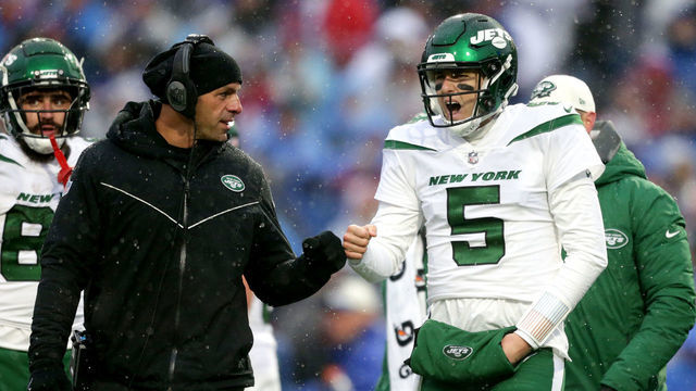 ORCHARD PARK, NEW YORK - DECEMBER 11: Mike White #5 of the New York Jets fist bumps head coach Robert Saleh of the New York Jets in the second quarter of a game against the Buffalo Bills at Highmark Stadium on December 11, 2022 in Orchard Park, New York.