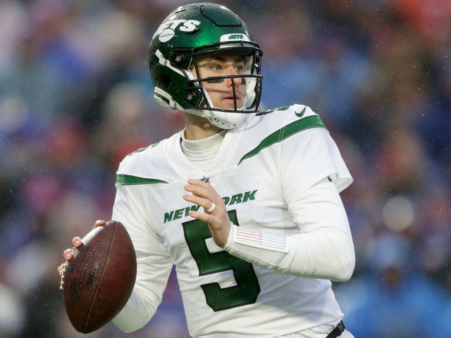 Mike White of the New York Jets looks to pass in the first half of