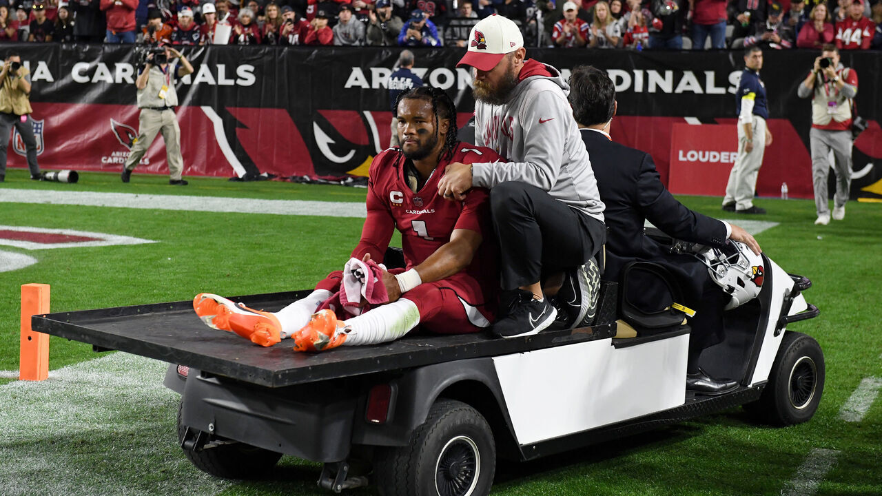 GLENDALE, ARIZONA - DECEMBER 12: Kyler Murray #1 of the Arizona Cardinals is carted off the field after being injured against the New England Patriots during the first quarter of the game at State Farm Stadium on December 12, 2022 in Glendale, Arizona.