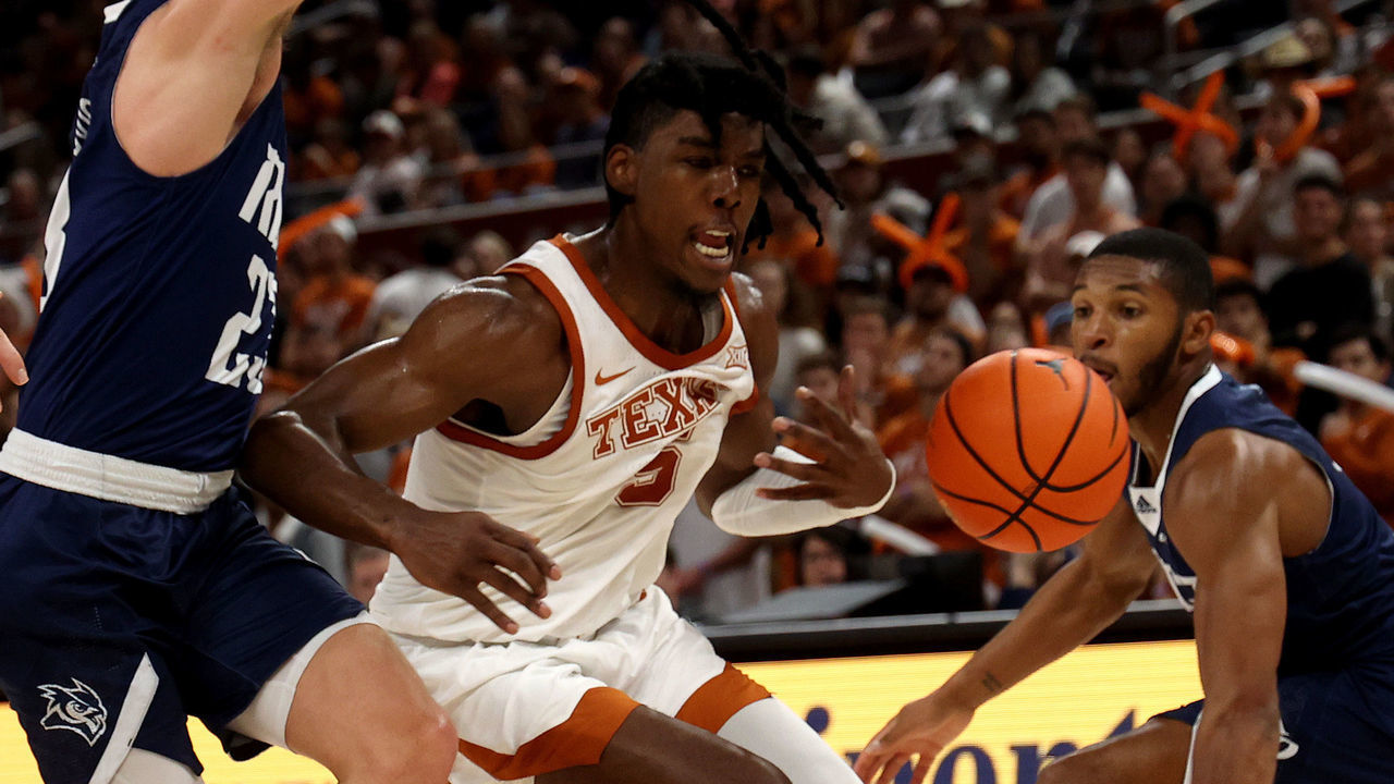 AUSTIN, TEXAS - DECEMBER 12: Marcus Carr #5 of the Texas Longhorns battles for a loose ball during the game between the Rice Owls and the Texas Longhorn at Moody Center on December 12, 2022 in Austin, Texas.Austin, Texas.