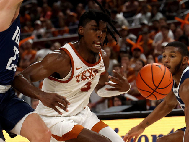 AUSTIN, TEXAS - DECEMBER 12: Marcus Carr #5 of the Texas Longhorns battles for a loose ball during the game between the Rice Owls and the Texas Longhorn at Moody Center on December 12, 2022 in Austin, Texas.Austin, Texas.