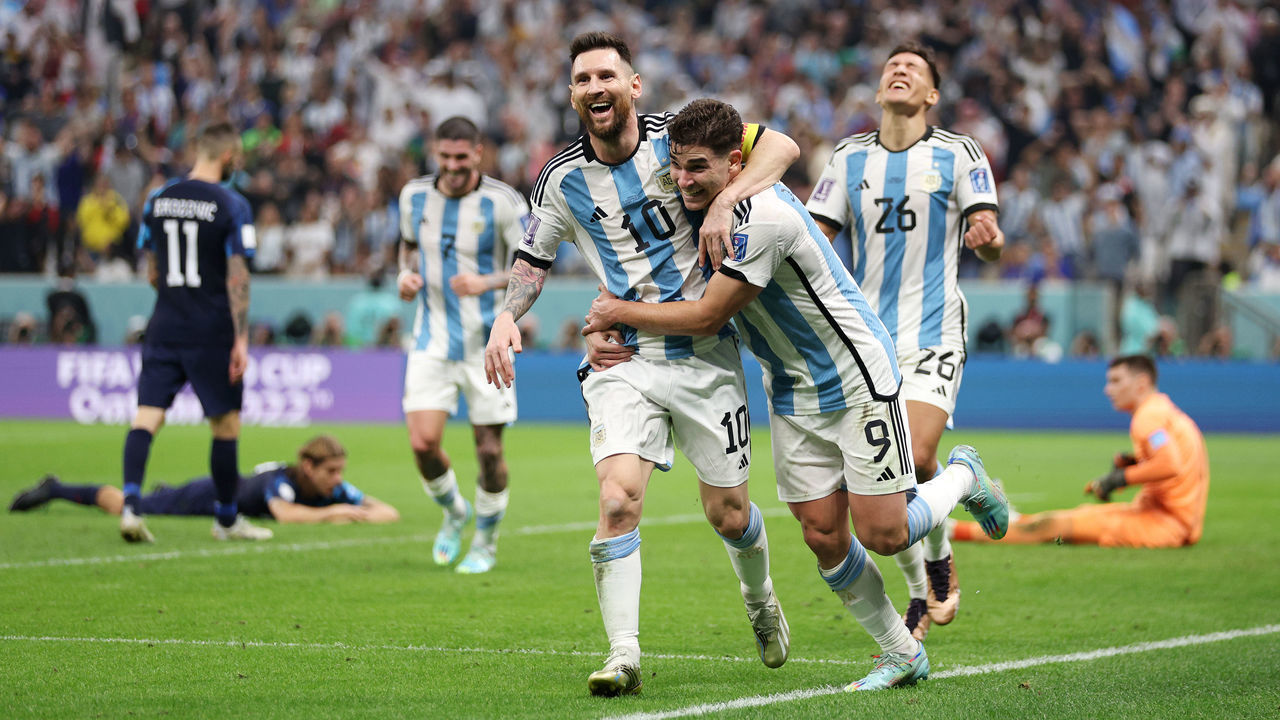LUSAIL CITY, QATAR - DECEMBER 13: Julian Alvarez celebrates with Lionel Messi of Argentina after scoring the team's second goal during the FIFA World Cup Qatar 2022 semi final match between Argentina and Croatia at Lusail Stadium on December 13, 2022 in Lusail City, Qatar.