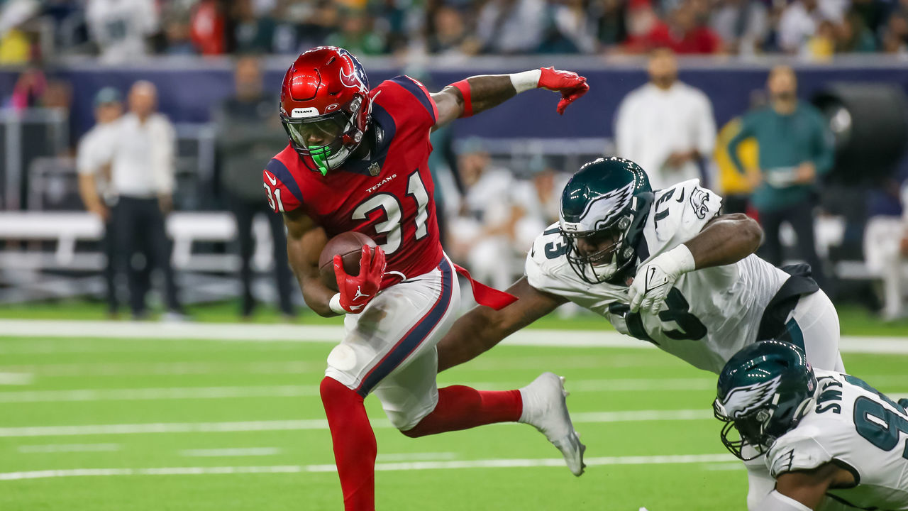 HOUSTON, TX - NOVEMBER 03: Houston Texans running back Dameon Pierce (31) tries to evade a tackle by Philadelphia Eagles defensive tackle Marvin Wilson (73) in the second quarter during the NFL game between the Philadelphia Eagles and Houston Texans on November 3, 2022 at NRG Stadium in Houston, Texas.