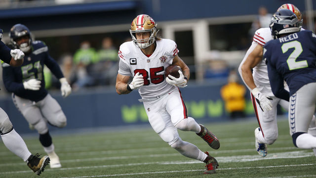 SEATTLE, WA - DECEMBER 5: George Kittle #85 of the San Francisco 49ers runs after making a catch during the game against the Seattle Seahawks at Lumen Field on December 5, 2021 in Seattle, Washington. The Seahawks defeated the 49ers 30-23.