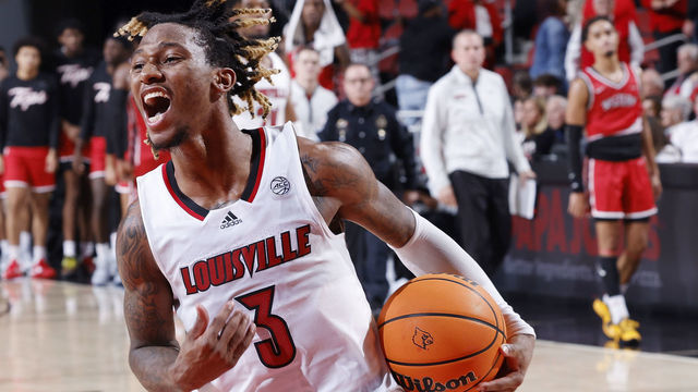 LOUISVILLE, KY - DECEMBER 14: Louisville Cardinals guard El Ellis (3) reacts after his team's first win of the season during a college basketball game against the Western Kentucky Hilltoppers on December 14, 2022 at KFC Yum! Center in Louisville, Kentucky.