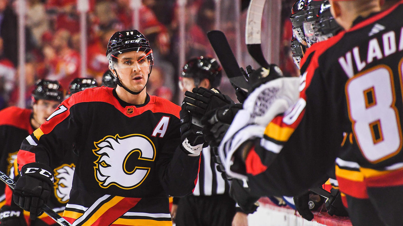 CALGARY, CANADA - DECEMBER 14: Mikael Backlund #11 of the Calgary Flames celebrates after scoring against the Vancouver Canucks during the first period of an NHL game at Scotiabank Saddledome on December 14, 2022 in Calgary, Alberta, Canada.
