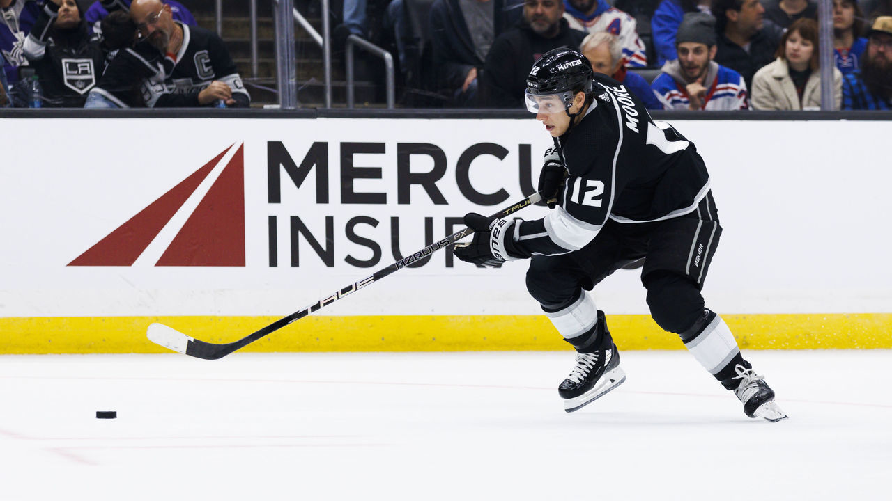 LOS ANGELES, CA - NOVEMBER 22: Los Angeles Kings left wing Trevor Moore (12) skates with the puck during an NHL hockey game between the New York Rangers and the Los Angeles Kings on November 22, 2022 at Crypto.com Arena in Los Angeles, CA.