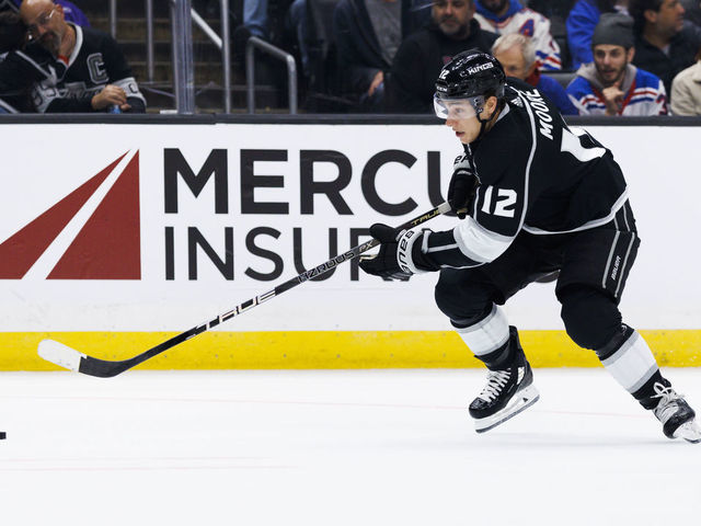 LOS ANGELES, CA - NOVEMBER 22: Los Angeles Kings left wing Trevor Moore (12) skates with the puck during an NHL hockey game between the New York Rangers and the Los Angeles Kings on November 22, 2022 at Crypto.com Arena in Los Angeles, CA.