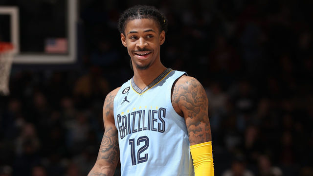 MEMPHIS, TN - DECEMBER 15: Ja Morant #12 of the Memphis Grizzlies smiles and looks on during the game against the Milwaukee Bucks on December 15, 2022 at FedExForum in Memphis, Tennessee. Mandatory Copyright Notice: Copyright 2022 NBAE
