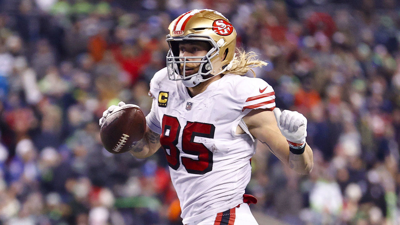 SEATTLE, WASHINGTON - DECEMBER 15: George Kittle #85 of the San Francisco 49ers carries the ball for a touchdown against the Seattle Seahawks during the third quarter of the game at Lumen Field on December 15, 2022 in Seattle, Washington.