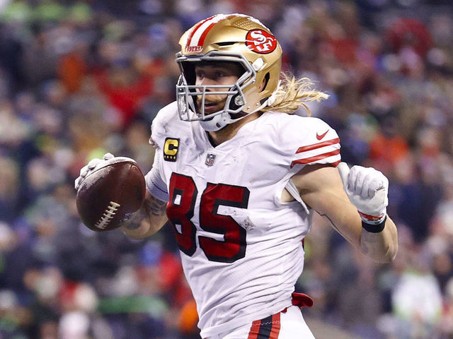 SEATTLE, WASHINGTON - DECEMBER 15: George Kittle #85 of the San Francisco 49ers carries the ball for a touchdown against the Seattle Seahawks during the third quarter of the game at Lumen Field on December 15, 2022 in Seattle, Washington.