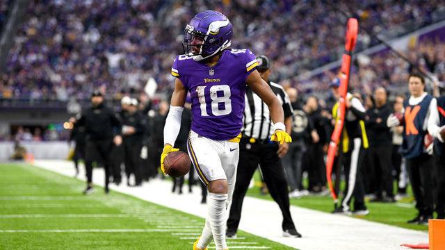 MINNEAPOLIS, MINNESOTA - DECEMBER 17: Justin Jefferson #18 of the Minnesota Vikings scores a touchdown against the Indianapolis Colts during the fourth quarter of the game at U.S. Bank Stadium on December 17, 2022 in Minneapolis, Minnesota.