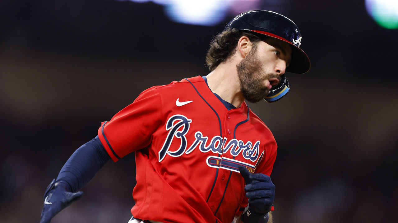 ATLANTA, GA - SEPTEMBER 30: Dansby Swanson #7 of the Atlanta Braves reacts after hitting a home run during the sixth inning against the New York Mets at Truist Park on September 30, 2022 in Atlanta, Georgia.