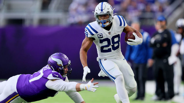 MINNEAPOLIS, MINNESOTA - DECEMBER 17: Jonathan Taylor #28 of the Indianapolis Colts carries the ball against the Minnesota Vikings during the first quarter at U.S. Bank Stadium on December 17, 2022 in Minneapolis, Minnesota.