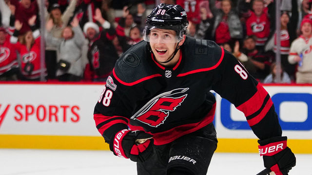 RALEIGH, NORTH CAROLINA - DECEMBER 17: Martin Necas #88 of the Carolina Hurricanes celebrates after scoring the game-winning goal in overtime to defeat the Dallas Stars at PNC Arena on December 17, 2022 in Raleigh, North Carolina.