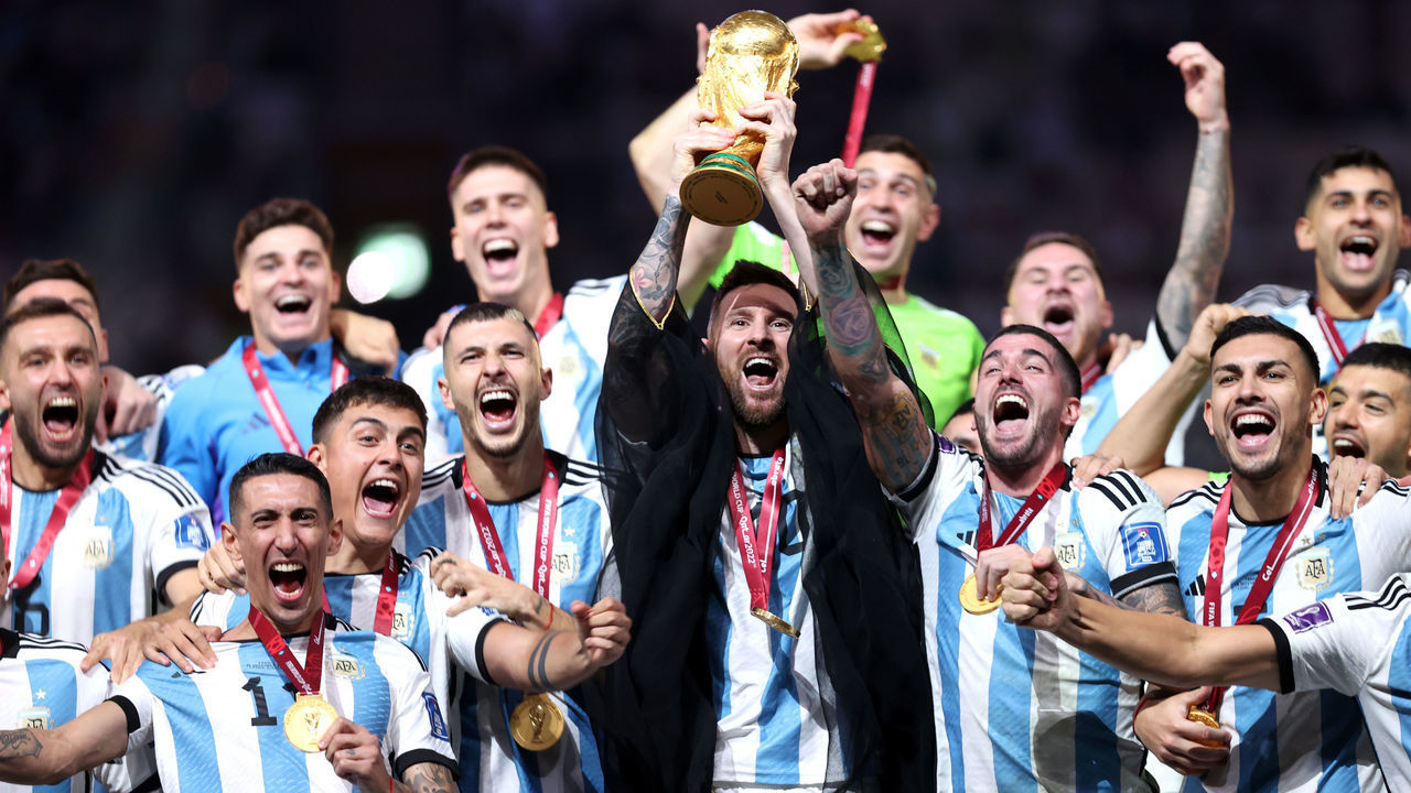 LUSAIL CITY, QATAR - DECEMBER 18: Lionel Messi of Argentina lifts the FIFA World Cup Qatar 2022 Winner's Trophy during the FIFA World Cup Qatar 2022 Final match between Argentina and France at Lusail Stadium on December 18, 2022 in Lusail City, Qatar.