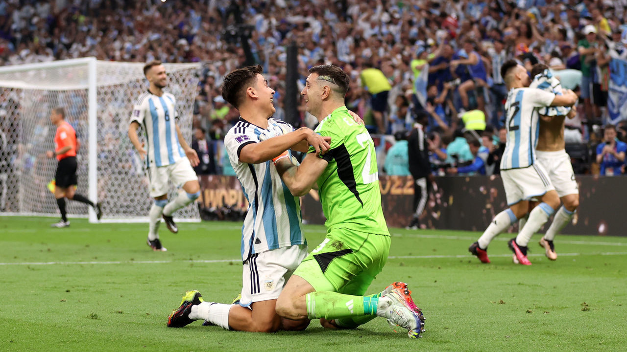LUSAIL CITY, QATAR - DECEMBER 18: Paulo Dybala and Emiliano Martinez of Argentina celebrate the fourth and winning penalty by Gonzalo Montiel in the penalty shootout during the FIFA World Cup Qatar 2022 Final match between Argentina and France at Lusail Stadium on December 18, 2022 in Lusail City, Qatar.