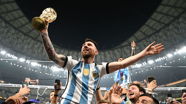 LUSAIL CITY, QATAR - DECEMBER 18: Lionel Messi of Argentina celebrates with the FIFA World Cup Qatar 2022 Winner's Trophy after the team's victory during the FIFA World Cup Qatar 2022 Final match between Argentina and France at Lusail Stadium on December 18, 2022 in Lusail City, Qatar.