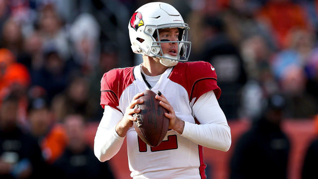 DENVER, COLORADO - DECEMBER 18: Colt McCoy #12 of the Arizona Cardinals looks to pass the ball during the first quarter in the game against the Denver Broncos at Empower Field At Mile High on December 18, 2022 in Denver, Colorado.
