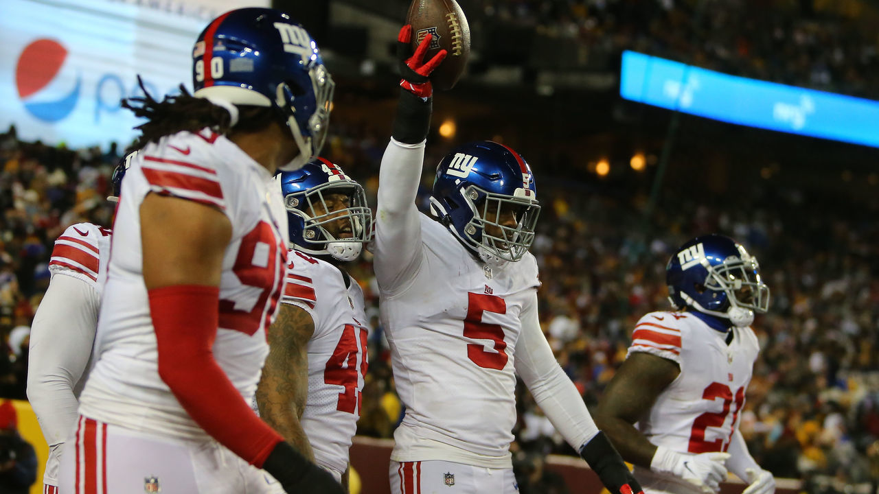 LANDOVER, MD - DECEMBER 18: New York Giants linebacker Kayvon Thibodeaux (5) teammates celebrate with him after he scooped up a fumble and returned it for a touchdown during the New York Giants game versus the Washington Commanders on December 18, 2022, at FedEx Field in Landover, MD.