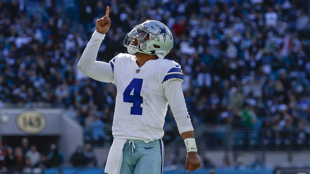 JACKSONVILLE, FL - DECEMBER 18: Dallas Cowboys quarterback Dak Prescott (4) reacts after throwing a touchdown pass during the game between the Dallas Cowboys and the Jacksonville Jaguars on December 18, 2022 at tIAA Bank Field in Jacksonville, Fl.