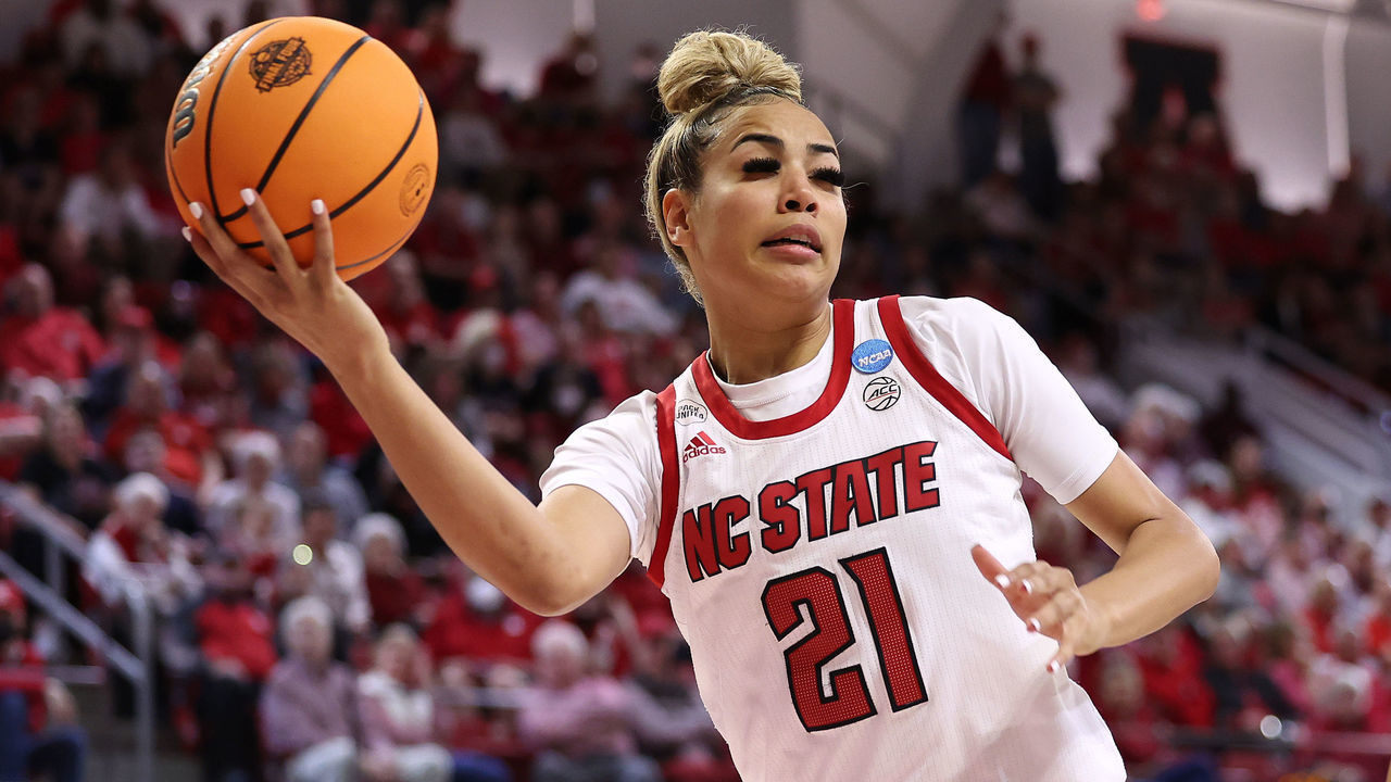 RALEIGH, NORTH CAROLINA - MARCH 21: Madison Hayes #21 of the NC State Wolfpack looks to pass as she drives against the Kansas State Wildcats in a second round game of the 2022 NCAA Women's Basketball Tournament held at at Reynolds Coliseum on March 21, 2022 in Raleigh, North Carolina.