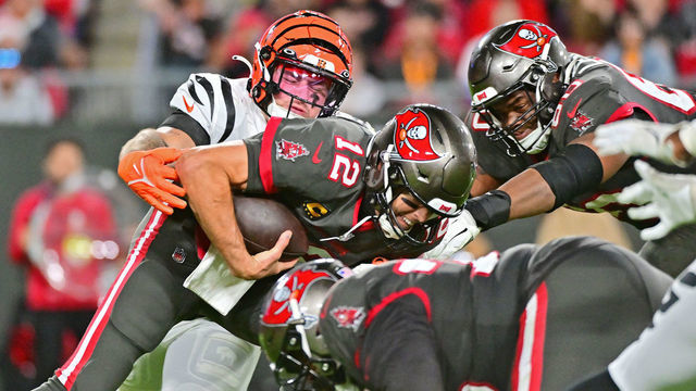 TAMPA, FLORIDA - DECEMBER 18: Logan Wilson #55 of the Cincinnati Bengals forces a fumble by Tom Brady #12 of the Tampa Bay Buccaneers during the third quarter at Raymond James Stadium on December 18, 2022 in Tampa, Florida.