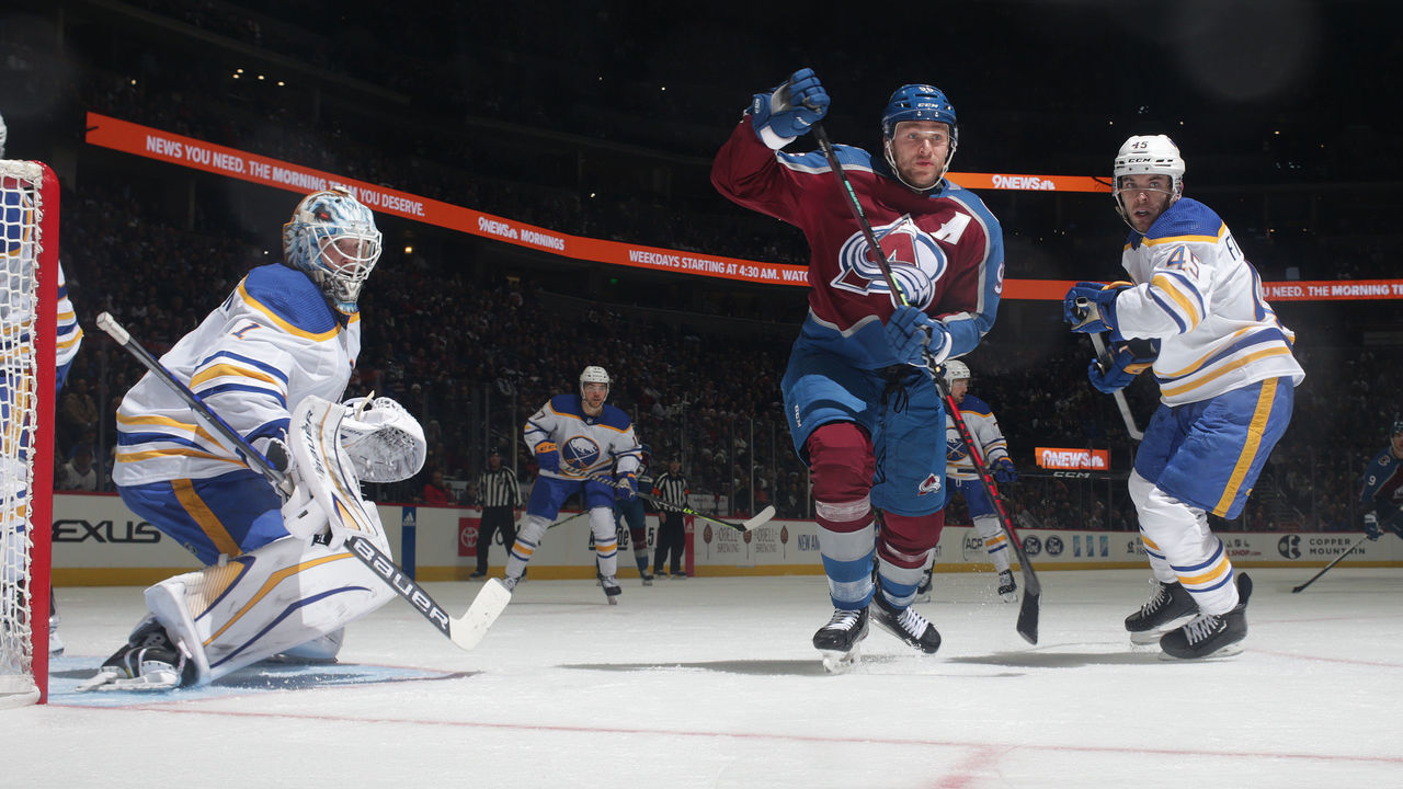 DENVER, COLORADO - DECEMBER 15: Mikko Rantanen #96 of the Colorado Avalanche skates against Casey Fitzgerald #45 of the Buffalo Sabres at Ball Arena on December 15, 2022 in Denver, Colorado.