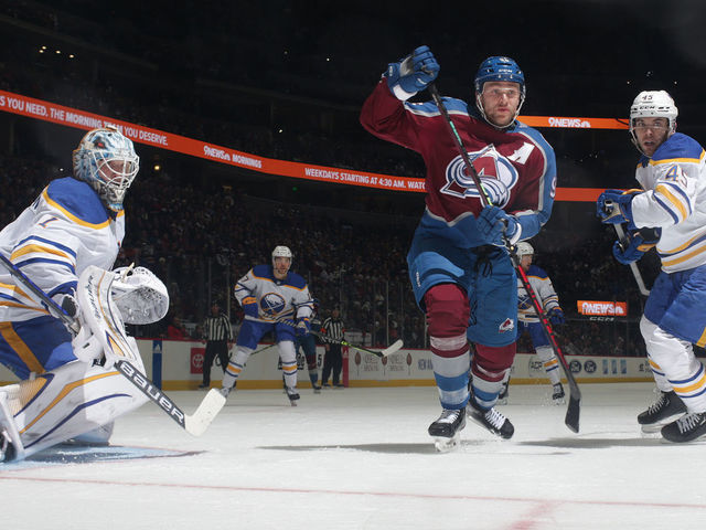 DENVER, COLORADO - DECEMBER 15: Mikko Rantanen #96 of the Colorado Avalanche skates against Casey Fitzgerald #45 of the Buffalo Sabres at Ball Arena on December 15, 2022 in Denver, Colorado.