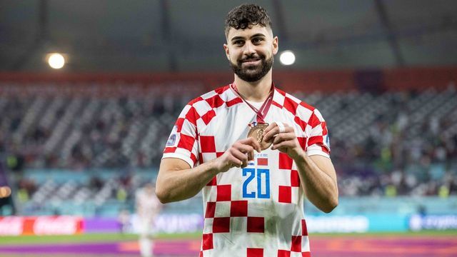 DOHA, QATAR - DECEMBER 17: Josko Gvardiol of Croatia celebrates with his bronze medal after the FIFA World Cup Qatar 2022 3rd Place match between Croatia and Morocco at Khalifa International Stadium on December 17, 2022 in Doha, Qatar.