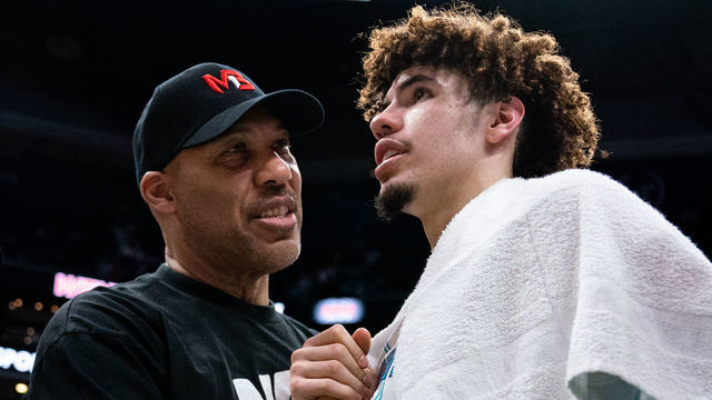 CHARLOTTE, NORTH CAROLINA - MARCH 09: (L-R) LaVar Ball talks with LaMelo Ball #2 of the Charlotte Hornets after their game against the Boston Celtics at Spectrum Center on March 09, 2022 in Charlotte, North Carolina.