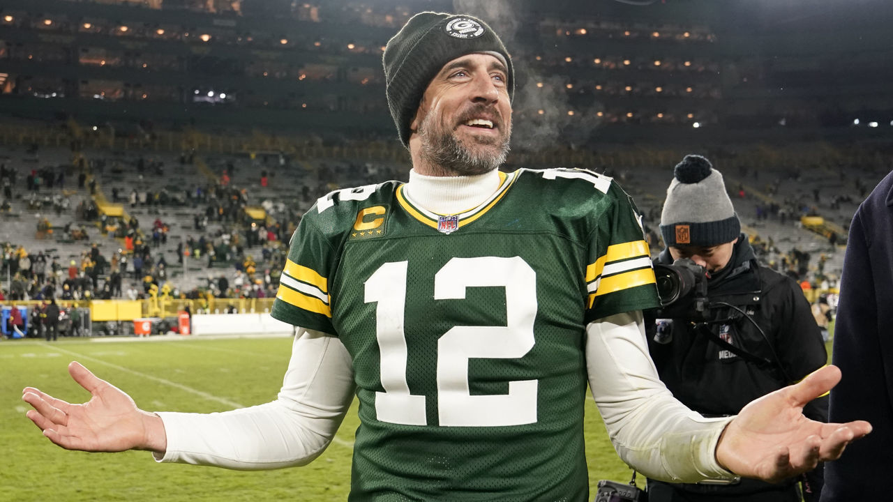 GREEN BAY, WISCONSIN - DECEMBER 19: Aaron Rodgers #12 of the Green Bay Packers reacts after defeating the Los Angeles Rams 24-12 at Lambeau Field on December 19, 2022 in Green Bay, Wisconsin.