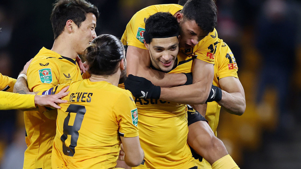 WOLVERHAMPTON, ENGLAND - DECEMBER 20: Raul Jimenez of Wolverhampton Wanderers celebrates with team mates Hugo Bueno, Hwang Hee-chan, Ruben Neves and Matheus Nunes of Wolverhampton Wanderers after scoring their sides first goal during the Carabao Cup Fourth Round match between Wolverhampton Wanderers and Gillingham at Molineux on December 20, 2022 in Wolverhampton, England.