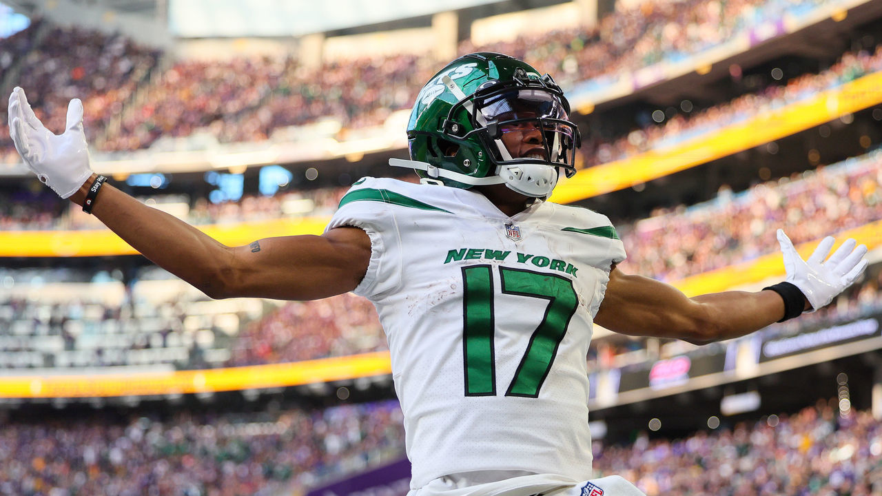 MINNEAPOLIS, MINNESOTA - DECEMBER 04: Garrett Wilson #17 of the New York Jets celebrates after a long gain during the fourth quarter against the Minnesota Vikings at U.S. Bank Stadium on December 04, 2022 in Minneapolis, Minnesota.