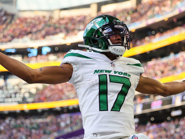 MINNEAPOLIS, MINNESOTA - DECEMBER 04: Garrett Wilson #17 of the New York Jets celebrates after a long gain during the fourth quarter against the Minnesota Vikings at U.S. Bank Stadium on December 04, 2022 in Minneapolis, Minnesota.