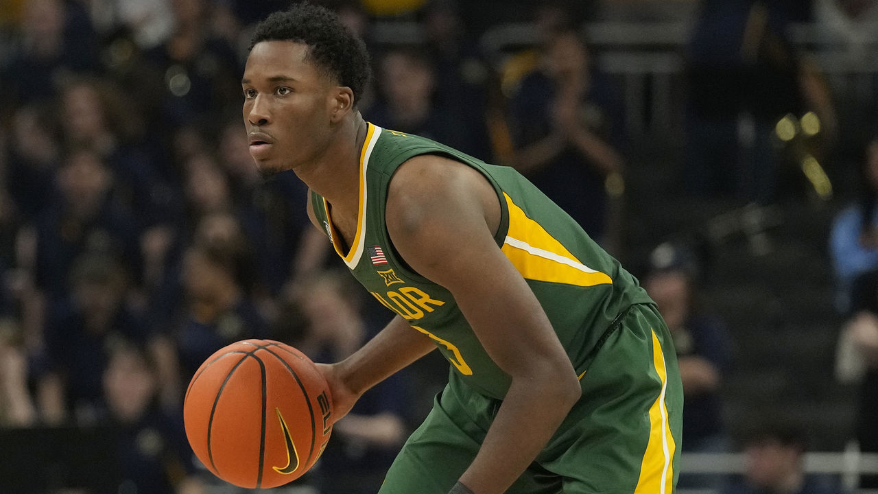 MILWAUKEE, WISCONSIN - NOVEMBER 29: Dale Bonner #3 of the Baylor Bears dribbles the ball against the Marquette Golden Eagles during the first half at Fiserv Forum on November 29, 2022 in Milwaukee, Wisconsin.