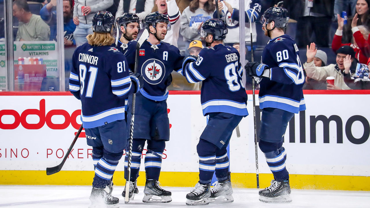WINNIPEG, CANADA - DECEMBER 20: Kyle Connor #81, Dylan DeMelo #2, Josh Morrissey #44, Sam Gagner #89 and Pierre-Luc Dubois #80 of the Winnipeg Jets celebrate a first period goal against the Ottawa Senators at the Canada Life Centre on December 20, 2022 in Winnipeg, Manitoba, Canada.