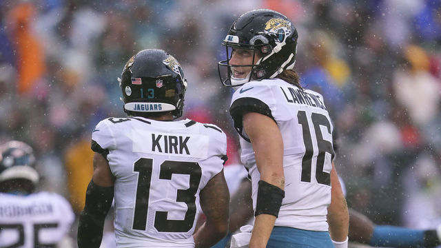 PHILADELPHIA, PA - OCTOBER 02: Christian Kirk #13 of the Jacksonville Jaguars talks to Trevor Lawrence #16 against the Philadelphia Eagles at Lincoln Financial Field on October 2, 2022 in Philadelphia, Pennsylvania.