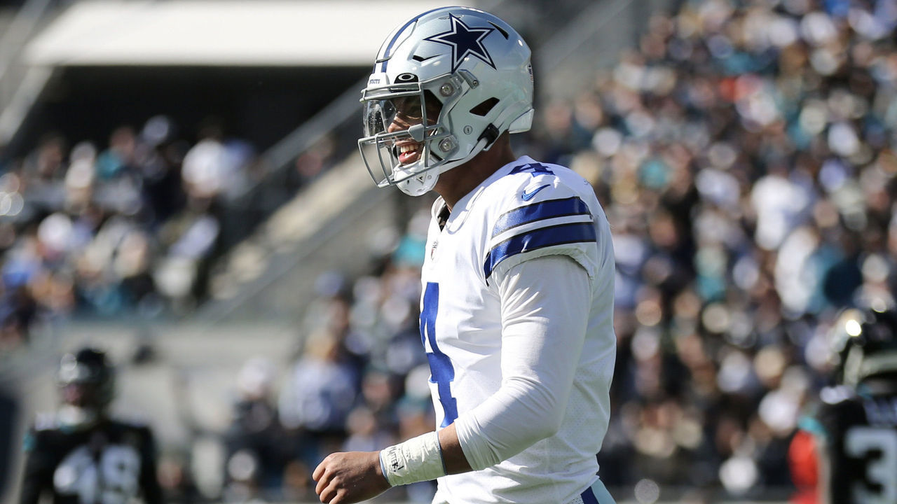 JACKSONVILLE, FLORIDA - DECEMBER 18: Dak Prescott #4 of the Dallas Cowboys reacts after a touchdown by Peyton Hendershot #89 during the first half against the Jacksonville Jaguars at TIAA Bank Field on December 18, 2022 in Jacksonville, Florida.