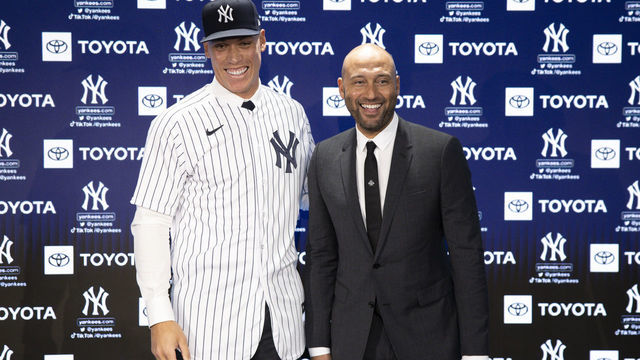 BRONX, NEW YORK - DECEMBER 21: Aaron Judge #99 of the New York Yankees poses for a photo with Derek Jeter after a press conference at Yankee Stadium on December 21, 2022 in Bronx, New York.
