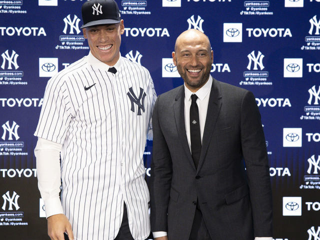 BRONX, NEW YORK - DECEMBER 21: Aaron Judge #99 of the New York Yankees poses for a photo with Derek Jeter after a press conference at Yankee Stadium on December 21, 2022 in Bronx, New York.