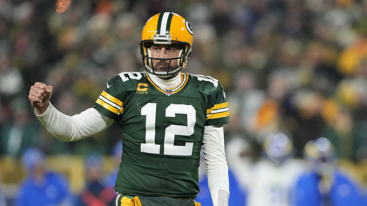 GREEN BAY, WISCONSIN - DECEMBER 19: Aaron Rodgers #12 of the Green Bay Packers reacts after a touchdown against the Los Angeles Rams in the second half at Lambeau Field on December 19, 2022 in Green Bay, Wisconsin.